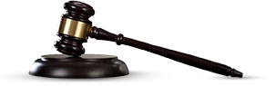 A judge 's gavel and a wooden block.